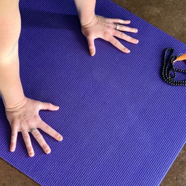 yoga therapy hands on yoga mat
